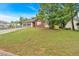 Attractive one-story home on a grassy lot, featuring a two-car garage and brick facade at 3035 Landington Way, Duluth, GA 30096