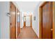 Long hallway with several closet doors at 3035 Landington Way, Duluth, GA 30096