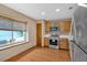 Well-lit kitchen with wood cabinets, modern appliances and window with blind at 3035 Landington Way, Duluth, GA 30096