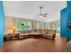 Cozy living room featuring wood flooring, large windows and a ceiling fan at 3035 Landington Way, Duluth, GA 30096