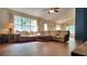 Spacious living room featuring wood flooring, large windows and a ceiling fan at 3035 Landington Way, Duluth, GA 30096