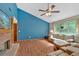 Spacious living room featuring wood flooring, a fireplace and a ceiling fan at 3035 Landington Way, Duluth, GA 30096