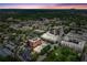 Elevated view of commercial and residential buildings amid the dense greenery and the glow of sunset at 1205 Mcclelen Way, Decatur, GA 30033
