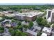 A high-angle view of apartment complexes, local businesses, and athletic courts in a community setting at 1205 Mcclelen Way, Decatur, GA 30033