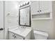 This bathroom features a vanity with a sink, a mirror, a toilet, and overhead lighting at 1205 Mcclelen Way, Decatur, GA 30033