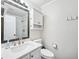 This bathroom features a glass-enclosed shower, a toilet, and a vanity with a mirror and sink at 1205 Mcclelen Way, Decatur, GA 30033