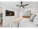 This bedroom features a flat-screen TV, ceiling fan, carpet floors, and wooded furniture at 1205 Mcclelen Way, Decatur, GA 30033
