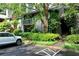 Two-story condo with brick accents, a covered balcony, and front parking at 1205 Mcclelen Way, Decatur, GA 30033