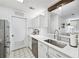 Modern kitchen with sleek countertops, updated appliances, and an open flow to the living spaces at 1205 Mcclelen Way, Decatur, GA 30033