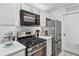 Bright kitchen with modern appliances, ample counter space, and classic white cabinets at 1205 Mcclelen Way, Decatur, GA 30033