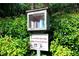 A community library box is nestled in the greenery for easy book-sharing and reading at 1205 Mcclelen Way, Decatur, GA 30033