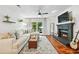 Inviting living room features a fireplace, plush sectional sofa, and a walk-out to an outdoor patio at 1205 Mcclelen Way, Decatur, GA 30033