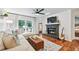 Inviting living room features hardwood floors, fireplace, and glass doors to a patio at 1205 Mcclelen Way, Decatur, GA 30033