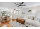 Open concept living and dining areas feature hardwood floors, modern lighting, and a ceiling fan at 1205 Mcclelen Way, Decatur, GA 30033