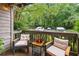 Relaxing patio space features two chairs with cushioned seating overlooking a lush green landscape at 1205 Mcclelen Way, Decatur, GA 30033