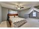 Spacious bedroom with vaulted ceilings, ceiling fan, and carpet flooring at 149 Stargrass Way, Grayson, GA 30017