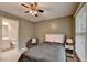 Comfortable bedroom with a chair, bedside table, and natural light from window at 149 Stargrass Way, Grayson, GA 30017