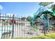 Community pool with a waterslide and plenty of seating for a fun and relaxing experience at 149 Stargrass Way, Grayson, GA 30017