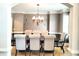 Dining room featuring hardwood floors, decorative chandelier, and natural light at 149 Stargrass Way, Grayson, GA 30017