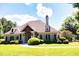 Charming home showcasing manicured landscaping and inviting architecture with an arched entryway and lush green lawn at 149 Stargrass Way, Grayson, GA 30017