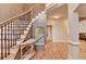 Bright foyer featuring hardwood floors, staircase with iron spindles and natural light at 149 Stargrass Way, Grayson, GA 30017