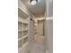 Hallway with built-in bookshelves, carpet flooring, and white trim at 149 Stargrass Way, Grayson, GA 30017