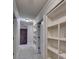 Hallway featuring built-in bookshelves, neutral paint, and recessed lighting at 149 Stargrass Way, Grayson, GA 30017