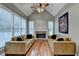 Cozy living room offers a vaulted ceiling, stone fireplace, and expansive windows for ample natural light at 149 Stargrass Way, Grayson, GA 30017
