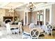 Inviting lounge area with stone fireplaces, coffered ceilings, ample seating, and an abundance of natural light at 149 Stargrass Way, Grayson, GA 30017