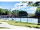 Community tennis courts surrounded by lush greenery and fencing, providing a recreational space for residents at 149 Stargrass Way, Grayson, GA 30017