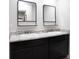 Modern bathroom with dual sinks, black cabinetry, and framed mirrors at 2272 Gateway Trl, Ellenwood, GA 30294