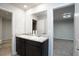 Bathroom with double sinks, granite counters, and dark cabinetry at 2272 Gateway Trl, Ellenwood, GA 30294