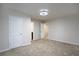 Bedroom with a ceiling fan and two doors, one leading to the bathroom at 2272 Gateway Trl, Ellenwood, GA 30294