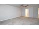 Spacious bedroom featuring neutral tones, a ceiling fan, and ample natural light, creating a serene retreat at 2272 Gateway Trl, Ellenwood, GA 30294