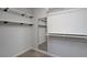 Walk-in closet providing storage with shelving and a mirror maximizing organization and functionality at 2272 Gateway Trl, Ellenwood, GA 30294