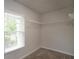 Walk-in closet offering abundant storage with shelving, and natural light, maximizing organization and convenience at 2272 Gateway Trl, Ellenwood, GA 30294
