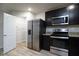 Modern kitchen features stainless steel appliances and a walk-in pantry at 2272 Gateway Trl, Ellenwood, GA 30294