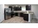 Modern kitchen features stainless steel appliances and a granite countertop island at 2272 Gateway Trl, Ellenwood, GA 30294