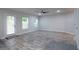Bright and airy living space with wood-look floors, a ceiling fan and a door to outside at 2272 Gateway Trl, Ellenwood, GA 30294