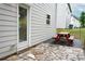 Exterior view showing a stone patio with a red picnic table at 2272 Gateway Trl, Ellenwood, GA 30294