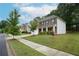 Charming two-story brick home featuring a manicured lawn and welcoming front porch at 2272 Gateway Trl, Ellenwood, GA 30294