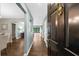 Entryway featuring a black front door and wood floors leading to the living spaces at 25305 Plantation Ne Dr, Atlanta, GA 30324
