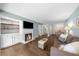 Spacious living room boasts modern fireplace, neutral colors and open layout at 25305 Plantation Ne Dr, Atlanta, GA 30324