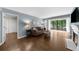 Comfortable living room featuring a fireplace and access to a private balcony at 25305 Plantation Ne Dr, Atlanta, GA 30324