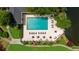 Aerial view of community pool with lounge chairs and a view of a lake at 25305 Plantation Ne Dr, Atlanta, GA 30324