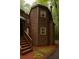 Charming home exterior with unique architecture surrounded by lush greenery and an adjacent walkway at 2565 Terrace Trl, Decatur, GA 30035