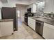 Updated kitchen with stainless steel appliances and decorative tile backsplash at 2565 Terrace Trl, Decatur, GA 30035