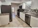 Modern kitchen with stainless steel appliances, granite countertops, and tiled backsplash at 2565 Terrace Trl, Decatur, GA 30035