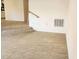 Open concept room with tile flooring and a staircase in the background at 2565 Terrace Trl, Decatur, GA 30035
