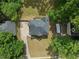 Aerial view of the property featuring a well-maintained lawn, a spacious driveway and a deck at 3075 Milford Sw, Marietta, GA 30008